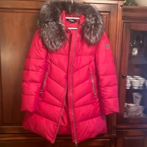 Women’s winter coat Kara with real fur, red , silver zipper details, never worn.